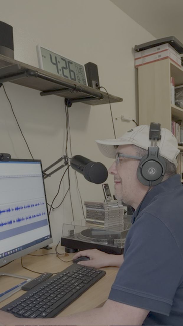 Mike Greenberg spinning records in his studio